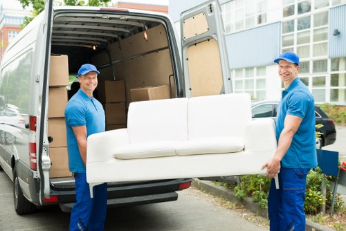 Team preparing a safe man and van move
