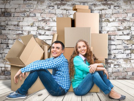 Packed office boxes and furniture ready for relocation in Pimlico