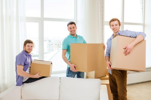 Moving office furniture in a Pimlico building with stairs and narrow access