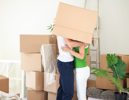 Furniture being carried through a Pimlico apartment building