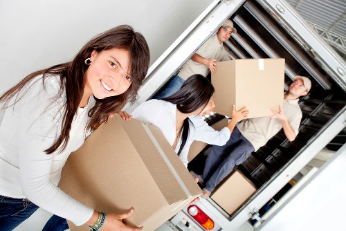 Local helper moving boxes for a Pimlico home or office delivery