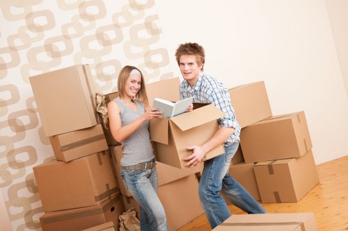 Packed office furniture and business items prepared for a Pimlico move