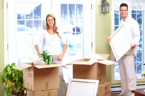 Packed boxes and furniture ready for a local move in Pimlico
